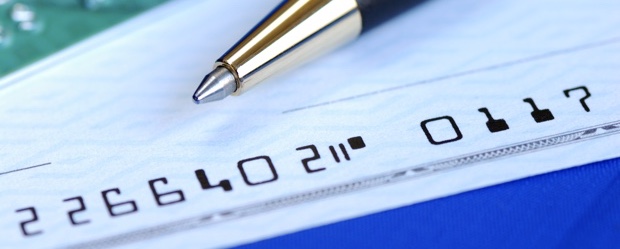 Write a check to pay the credit card bill isolated on blue